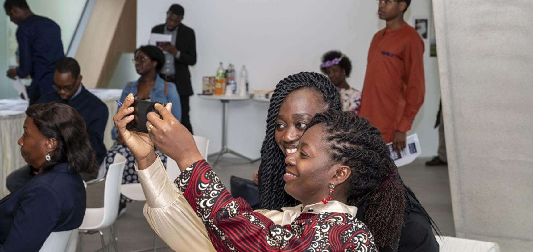 two women take a selfie at the event