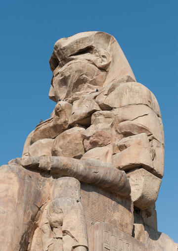 Photo of the Colossus of Memnon from the bottom right looking up
