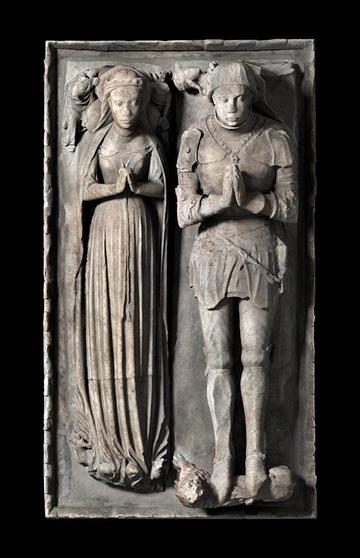 Efigy of woman and knight side by side in burial monument