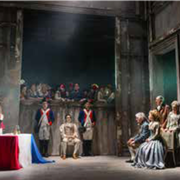 Stage setting with actors performing a play