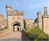 The facade of Powderham Castle with its gateway and turrets 