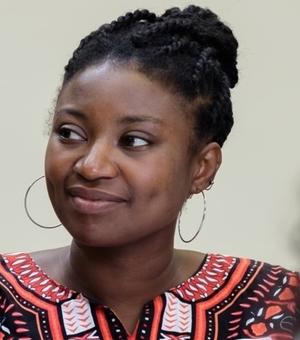 woman smiles to the left