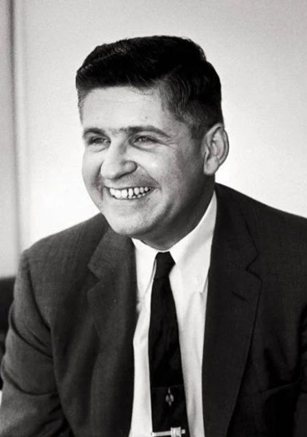  John Howard Griffin smiles widely. 